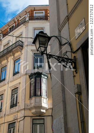 Facade of an old house with a bay window, European historical buildings, Lisbon, Portugal Facade of an old house with a bay window, European historical buildings, Lisbon, Portugal 122737812