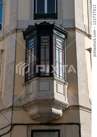 Facade of an old house with a bay window, European historical buildings, Lisbon, Portugal 122737813