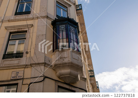 Facade of an old house with a bay window, European historical buildings, Lisbon, Portugal 122737818