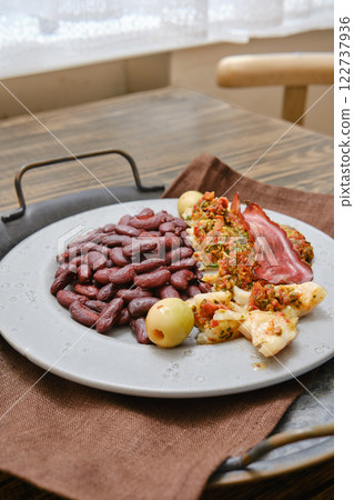 Delicious with roasted fish and red beans, garnished with slices of bacon Delicious with roasted fish and red beans, garnished with slices of bacon 122737936