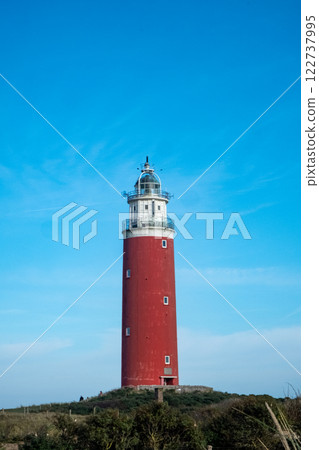 Eierland, De Cocksdorp, Texel, The Netherlands, Oktober 28th, 2024, The Iconic Red Lighthouse Stands Eierland, De Cocksdorp, Texel, The Netherlands, Oktober 28th, 2024, The Iconic Red Lighthouse Stands 122737995