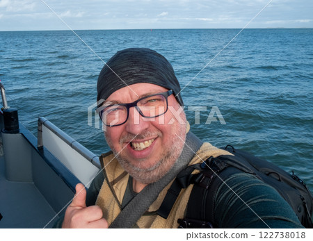 Joyful Voyage A Happy, Smiling Sailor Enjoying Life on the Open Sea with Friends and Nature Joyful Voyage A Happy, Smiling Sailor Enjoying Life on the Open Sea with Friends and Nature 122738018