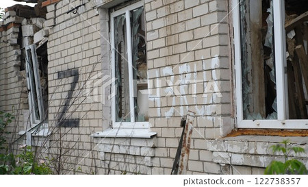 View to destroyed residential buildings at Kharkivska oblast. Ruined houses after bomb attacks on ukrainian territory from russia army. Consequences of russian invasion of Ukraine. Slow motion View to destroyed residential buildings at Kharkivska oblast. Ruined houses after bomb attacks on ukrainian territory from russia army. Consequences of russian invasion of Ukraine. Slow motion 122738357