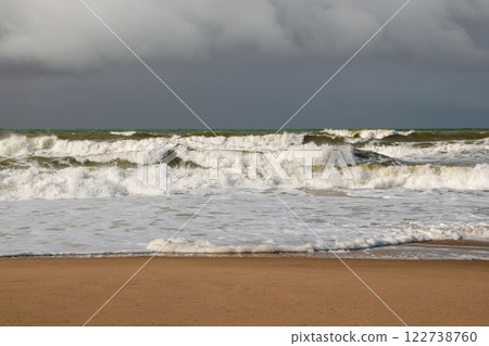 Empty wild sandy beach, Atlantic Ocean seascape, sea waves, beautiful cloudscape, dramatic landscape, travel content Empty wild sandy beach, Atlantic Ocean seascape, sea waves, beautiful cloudscape, dramatic landscape, travel content 122738760