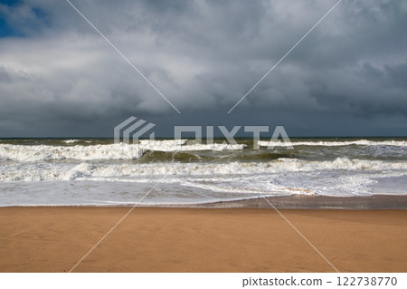 Empty wild sandy beach, Atlantic Ocean seascape, sea waves, beautiful cloudscape, dramatic landscape, travel content, Lisbon, Portugal Empty wild sandy beach, Atlantic Ocean seascape, sea waves, beautiful cloudscape, dramatic landscape, travel content, Lisbon, Portugal 122738770