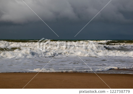 Empty wild sandy beach, Atlantic Ocean seascape, sea waves, beautiful cloudscape, dramatic landscape, travel content, Lisbon, Portugal Empty wild sandy beach, Atlantic Ocean seascape, sea waves, beautiful cloudscape, dramatic landscape, travel content, Lisbon, Portugal 122738779