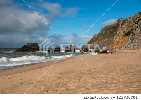 Empty wild sandy beach, Atlantic Ocean seascape, sea waves, beautiful cloudscape, dramatic landscape, travel content, Lisbon, Portugal Empty wild sandy beach, Atlantic Ocean seascape, sea waves, beautiful cloudscape, dramatic landscape, travel content, Lisbon, Portugal 122738781