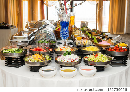 Snacks for the holiday, catering. Various snacks. Assortment of salads and buffet dishes. Meat, fish, cheese, salads, fruits and vegetables, sauces and canapes for celebrating a festive event. Snacks for the holiday, catering. Various snacks. Assortment of salads and buffet dishes. Meat, fish, cheese, salads, fruits and vegetables, sauces and canapes for celebrating a festive event. 122739026