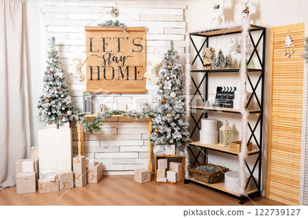 Christmas decoration with snowy trees paper poster. New Year interior with New Year decor on shelves Christmas decoration with snowy trees paper poster. New Year interior with New Year decor on shelves 122739127