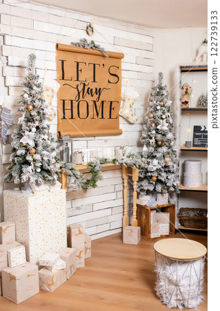 Christmas decoration with snowy trees paper poster. New Year interior with New Year decor on shelves 122739133