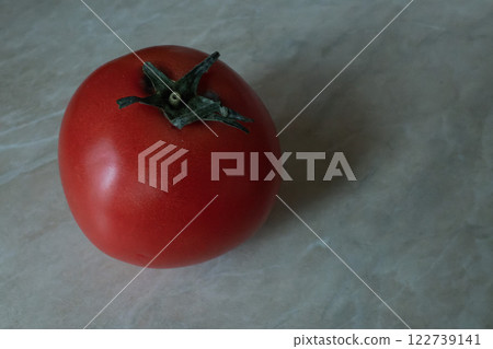 A Single Ripe Red Tomato 122739141