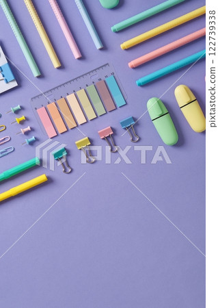 Stationery banner in green, yellow, pink and blue pastel colors on light purple background. Space for your text. Stationery banner in green, yellow, pink and blue pastel colors on light purple background. Space for your text. 122739338