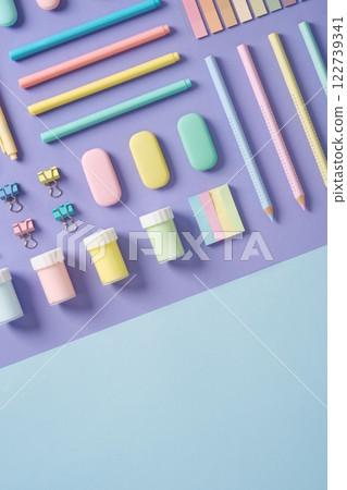 Stationery banner in green, yellow, pink and blue pastel colors on light purple and blue background. Space for your text. Stationery banner in green, yellow, pink and blue pastel colors on light purple and blue background. Space for your text. 122739341