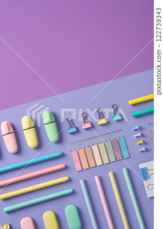 Stationery banner in green, yellow, pink and blue pastel colors on light purple and violet background. Space for your text. Stationery banner in green, yellow, pink and blue pastel colors on light purple and violet background. Space for your text. 122739343