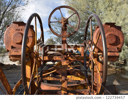 Rusty gears background, old rural agricultural machinery, rustic industrial landscape, dirty vintage gears 122739457
