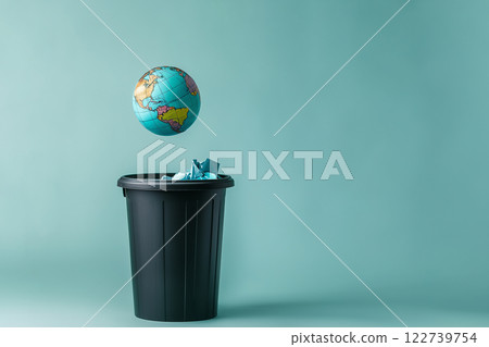 globe falls into the trash can, ecology concept globe falls into the trash can, ecology concept 122739754