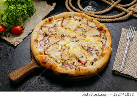 Gourmet pizza with grilled chicken, mushrooms, red onion, quail eggs, and parmesan Gourmet pizza with grilled chicken, mushrooms, red onion, quail eggs, and parmesan 122741038