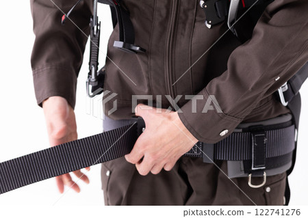 Image of wearing a construction harness (stock photo) Image of wearing a construction harness (stock photo) 122741276