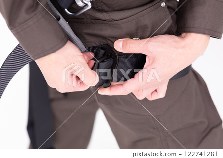 Image of wearing a construction harness (stock photo) 122741281
