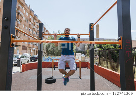 Young man practicing sports outside Young man practicing sports outside 122741369