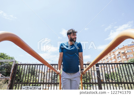 Young man practicing sports outside Young man practicing sports outside 122741370