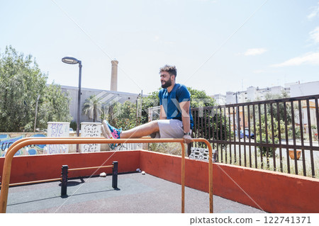 Young man practicing sports outside Young man practicing sports outside 122741371