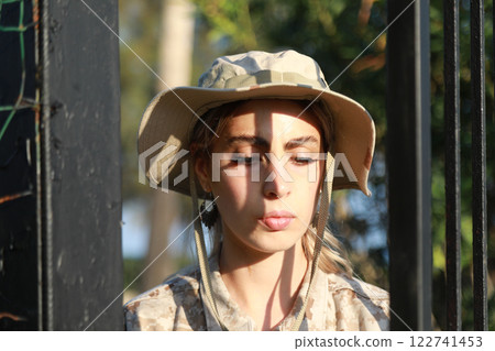 Young Woman Soldier Escaping From Prison 122741453