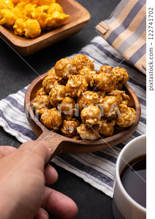 Hand holding popcorn 122741702