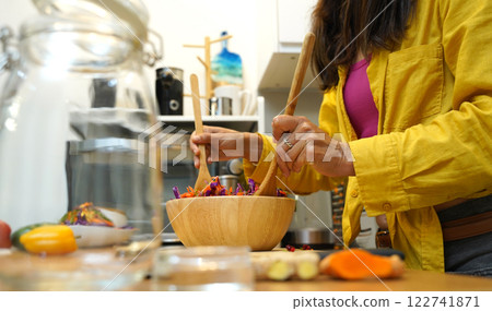 Young woman is broadcasting live from workshop how to prepare a vegetarian food Young woman is broadcasting live from workshop how to prepare a vegetarian food 122741871