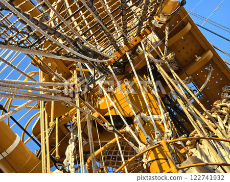 Ropes stretched across the masts of an old ship Ropes stretched across the masts of an old ship 122741932