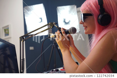 Beautiful young singer and musician broadcast from her home studio Beautiful young singer and musician broadcast from her home studio 122742034