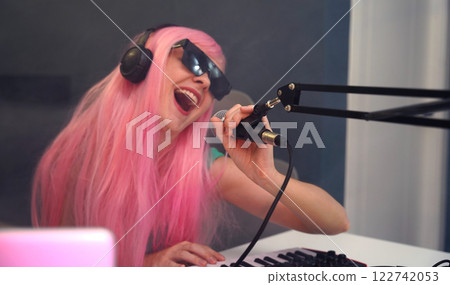 Beautiful young singer and musician broadcast from her home studio 122742053