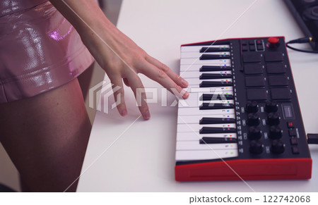 Beautiful young singer and musician broadcast from her home studio 122742068