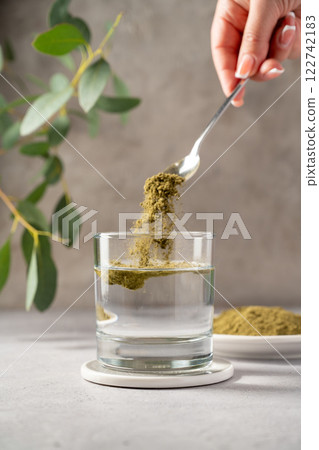 Moringa Matcha Wheatgrass Green Powder drink. Food supplement, healthy food lifesyle Moringa Matcha Wheatgrass Green Powder drink. Food supplement, healthy food lifesyle 122742183