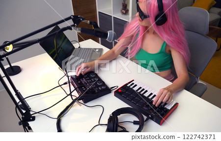 Beautiful young singer and musician broadcast from her home studio 122742371