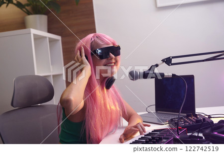 Beautiful young singer and musician broadcast from her home studio 122742519