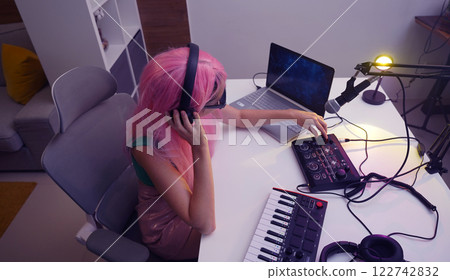 Beautiful young singer and musician broadcast from her home studio 122742832
