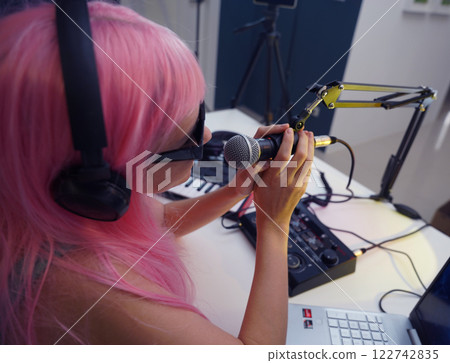 Beautiful young singer and musician broadcast from her home studio Beautiful young singer and musician broadcast from her home studio 122742835