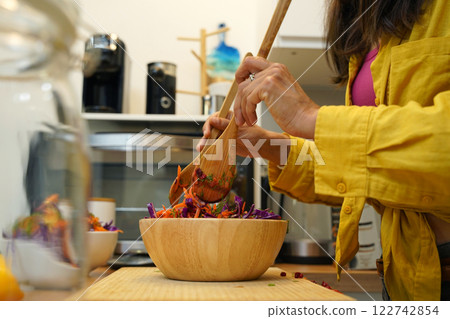 Young woman is broadcasting live from workshop how to prepare a vegetarian food Young woman is broadcasting live from workshop how to prepare a vegetarian food 122742854