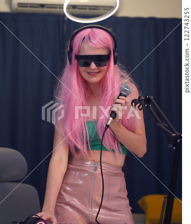 Beautiful young singer and musician broadcast from her home studio Beautiful young singer and musician broadcast from her home studio 122743255
