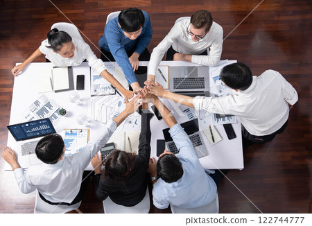 Group of diverse office worker join hand together in office. Prudent Group of diverse office worker join hand together in office. Prudent 122744777