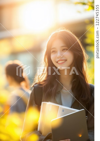 Smiling female college student on campus 122745355
