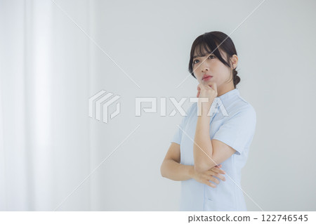 Depressed nurse Depressed nurse 122746545