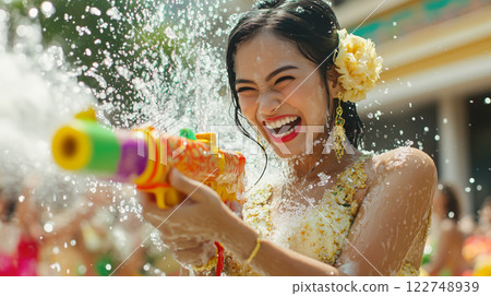 A group of people joyfully splash water on each other during Songkran Day. The concept of festivity, cultural tradition, and the spirit of renewal. Generative AI. 122748939