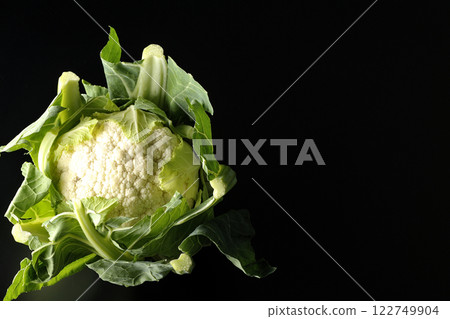 Cauliflower photographed against a black background 122749904