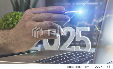 Visionary Tech Leader: Strategic Planning for 2025 with a Futuristic Laptop Workspace 122750051