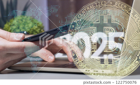 Hands Using Smartphone and Laptop with Overlay of Bitcoin Cryptocurrency Symbol, Digital World Map, and Blockchain Technology Concept 122750076