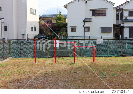 Red horizontal bars in a quiet park in a residential area of Japan 122750495