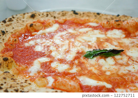 Close-up of a very large Margherita pizza Close-up of a very large Margherita pizza 122752711