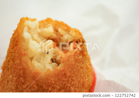 Half-eaten arancini, a famous Italian dish 122752742